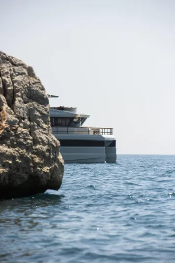 Lazzara Lpc 300 Yacht Photos Pics Modern Lazzara LPC 300 yacht near rocky coastline, 2027 model.