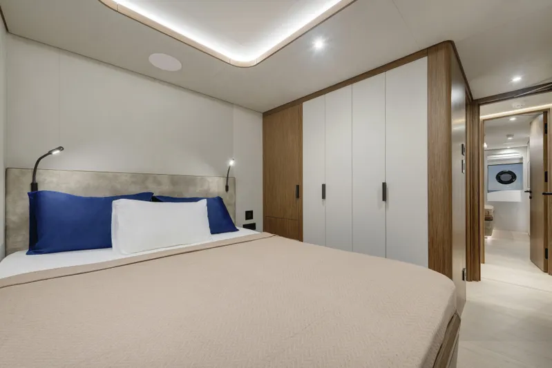 Lazzara Lpc 300 Yacht Photos Pics Luxurious bedroom interior of 2027 Lazzara LPC 300 yacht with modern design and ambient lighting.