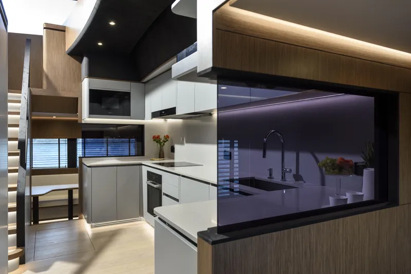 Lazzara Lpc 300 Yacht Photos Pics Modern kitchen interior on 2027 Lazzara LPC 300 yacht, featuring sleek cabinetry and ambient lighting.