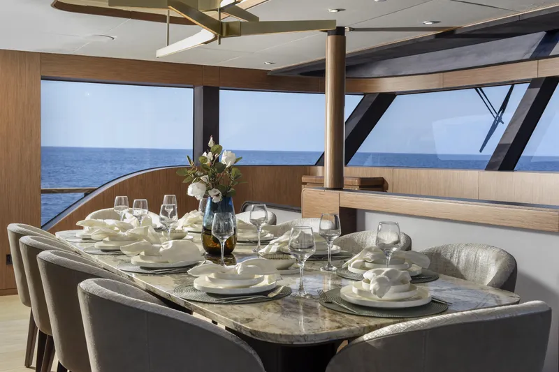 Lazzara Lpc 300 Yacht Photos Pics Luxurious dining area on 2027 Lazzara LPC 300 yacht with ocean view.