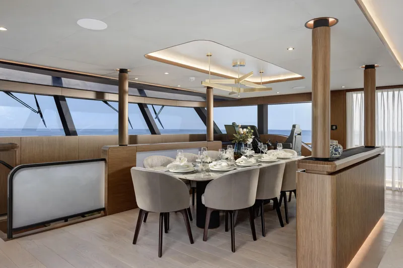 Lazzara Lpc 300 Yacht Photos Pics Luxurious dining area on 2027 Lazzara LPC 300 yacht with elegant table setting and modern design.