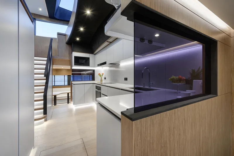 Lazzara Lpc 300 Yacht Photos Pics Modern kitchen interior on 2027 Lazzara LPC 300 yacht, featuring sleek design and ambient lighting.