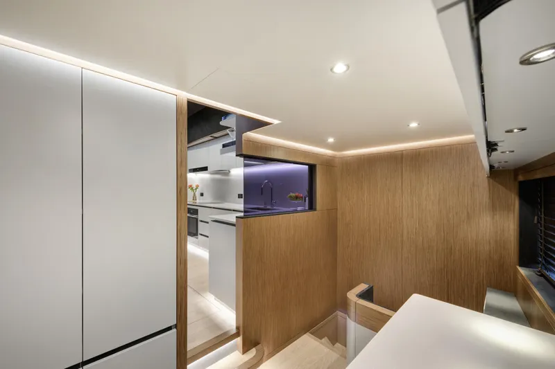 Lazzara Lpc 300 Yacht Photos Pics Modern interior of 2027 Lazzara LPC 300 yacht with sleek wood paneling and ambient lighting.