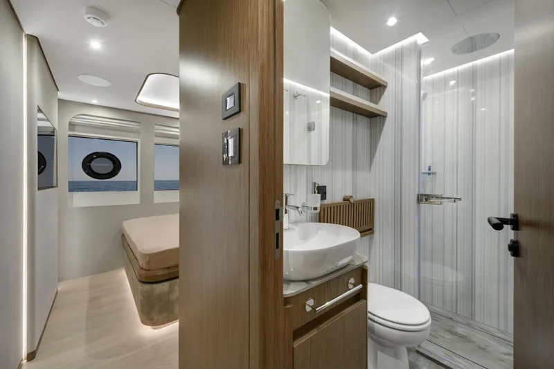 Lazzara Lpc 300 Yacht Photos Pics Luxurious interior of 2027 Lazzara LPC 300 yacht featuring modern bathroom and bedroom.
