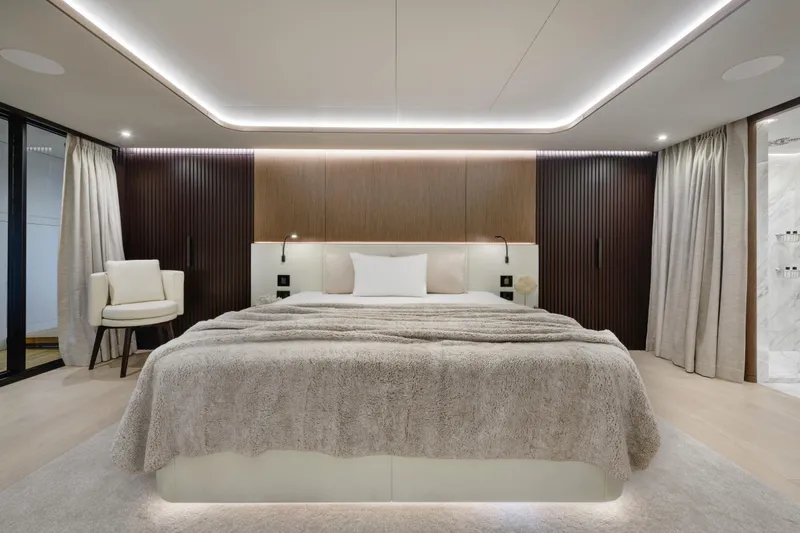 Lazzara Lpc 300 Yacht Photos Pics Luxurious bedroom interior on 2027 Lazzara LPC 300 yacht, featuring modern design and ambient lighting.