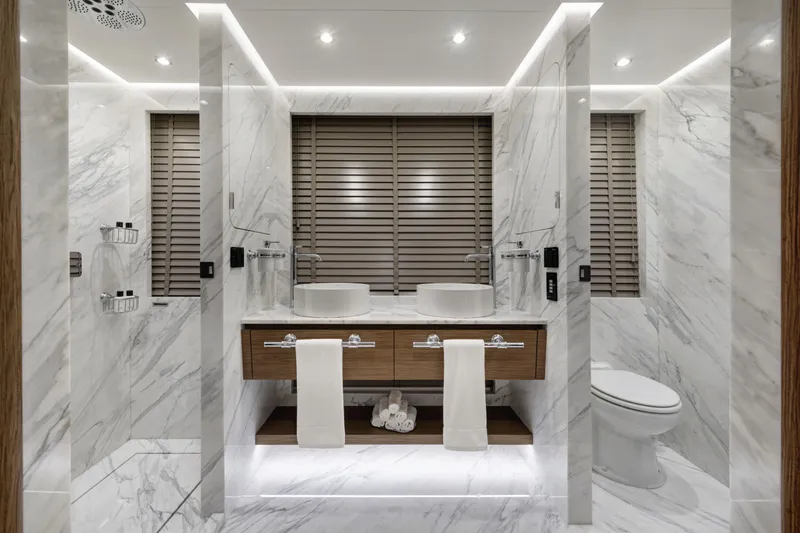 Lazzara Lpc 300 Yacht Photos Pics Luxurious marble bathroom in 2027 Lazzara LPC 300 yacht, featuring dual sinks and modern fixtures.