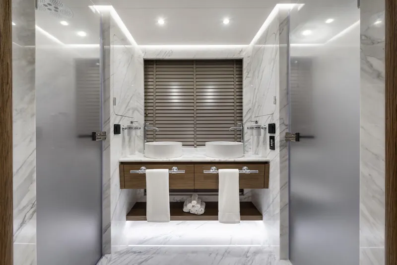 Lazzara Lpc 300 Yacht Photos Pics Luxurious bathroom in 2027 Lazzara LPC 300 yacht with modern fixtures and marble design.