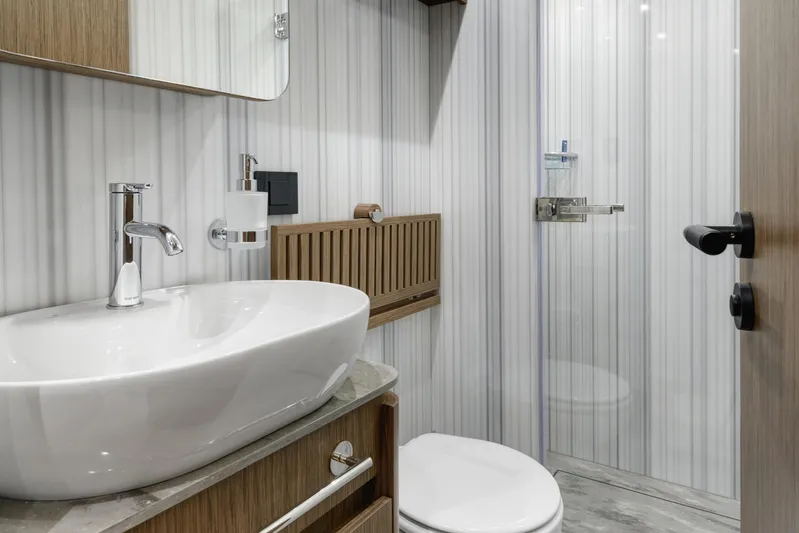 Lazzara Lpc 300 Yacht Photos Pics Modern bathroom in 2027 Lazzara LPC 300 yacht with sleek fixtures and elegant design.