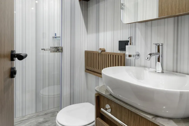 Lazzara Lpc 300 Yacht Photos Pics Modern bathroom interior on 2027 Lazzara LPC 300 yacht, featuring sleek fixtures and elegant design.