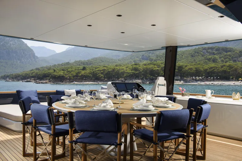 Lazzara Lpc 300 Yacht Photos Pics Luxurious dining area on 2027 Lazzara LPC 300 yacht with scenic ocean view.