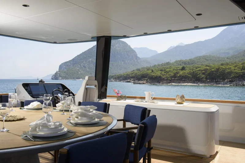 Lazzara Lpc 300 Yacht Photos Pics Luxurious 2027 Lazzara LPC 300 yacht interior with elegant dining setup and scenic ocean view.