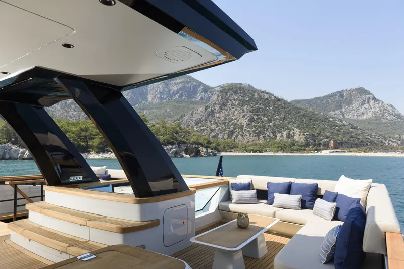 Lazzara Lpc 300 Yacht Photos Pics Luxurious 2027 Lazzara LPC 300 yacht with elegant deck and scenic mountain backdrop.