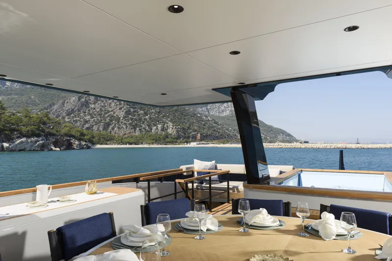 Lazzara Lpc 300 Yacht Photos Pics Luxurious 2027 Lazzara LPC 300 yacht with elegant dining area and scenic ocean view.