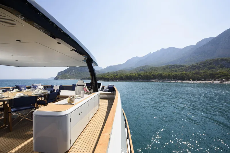 Lazzara Lpc 300 Yacht Photos Pics Luxurious 2027 Lazzara LPC 300 yacht cruising near scenic coastline and mountains.