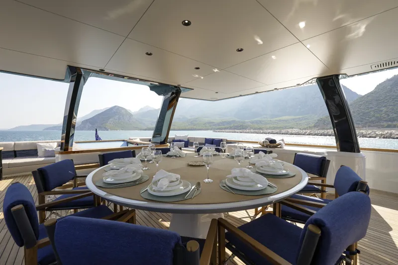 Lazzara Lpc 300 Yacht Photos Pics Luxurious dining area on 2027 Lazzara LPC 300 yacht with scenic ocean view.