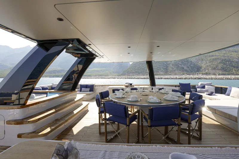Lazzara Lpc 300 Yacht Photos Pics Luxurious 2027 Lazzara LPC 300 yacht deck with elegant dining setup and scenic ocean view.