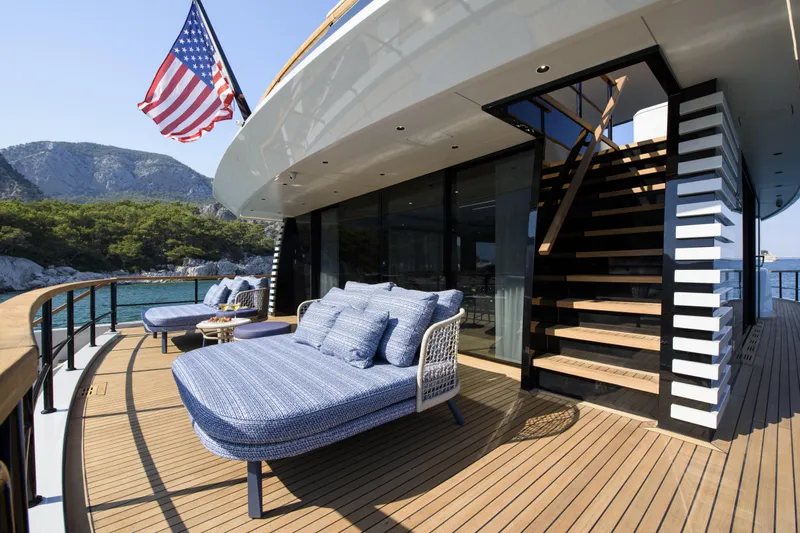 Lazzara Lpc 300 Yacht Photos Pics Luxurious 2027 Lazzara LPC 300 yacht deck with lounge chairs and American flag.