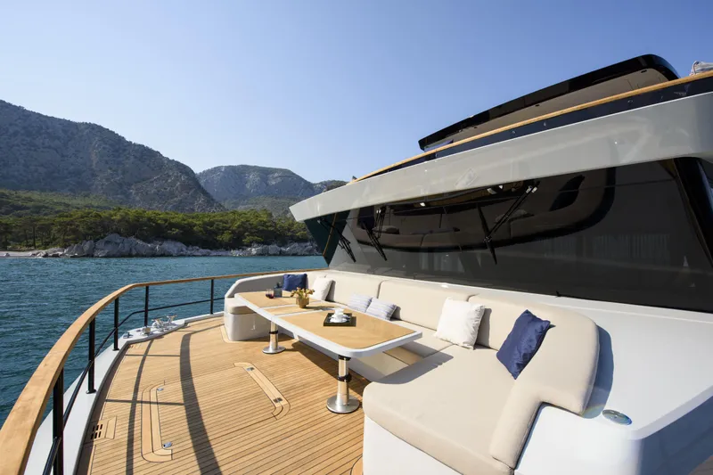 Lazzara Lpc 300 Yacht Photos Pics Luxurious 2027 Lazzara LPC 300 yacht deck with elegant seating and scenic mountain backdrop.