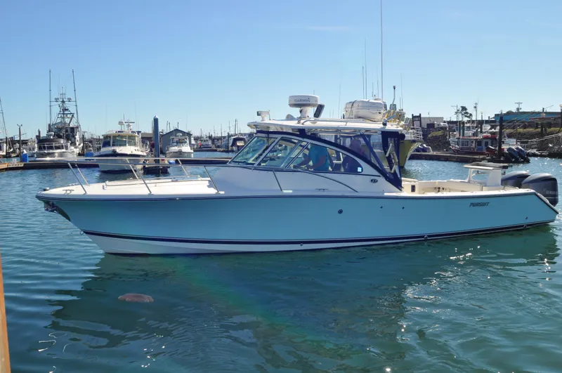  Yacht Photos Pics 2006 Pursuit 345 Drummond Island Sportfish boat docked in marina.