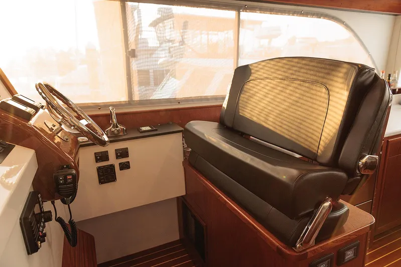  Yacht Photos Pics Luxurious helm station of 2022 Composite Yacht CY46 with leather seating and wooden accents.