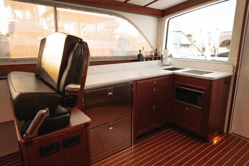  Yacht Photos Pics Luxurious 2022 Composite Yacht CY46 interior with sleek kitchen and seating area.
