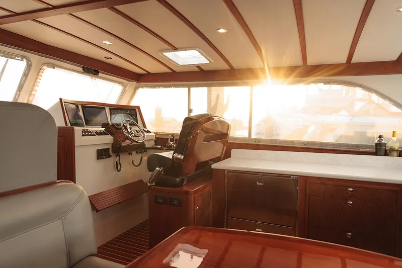  Yacht Photos Pics Luxurious 2022 Composite Yacht CY46 interior with elegant wood finish and sunset view.