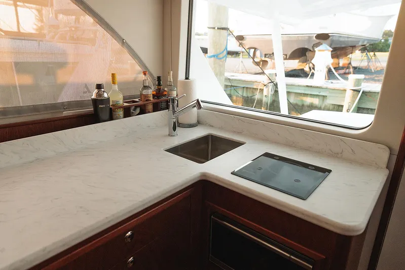  Yacht Photos Pics Luxurious 2022 Composite Yacht CY46 kitchen with marble countertop and modern appliances.