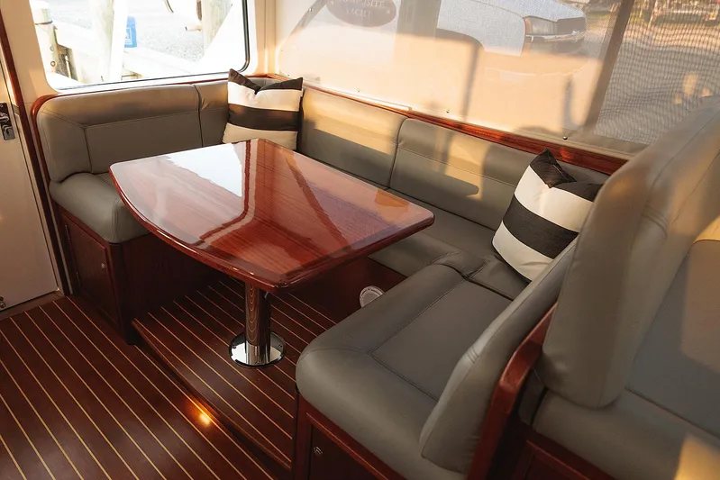  Yacht Photos Pics Luxurious interior of 2022 Composite Yacht CY46 with elegant seating and polished wood table.
