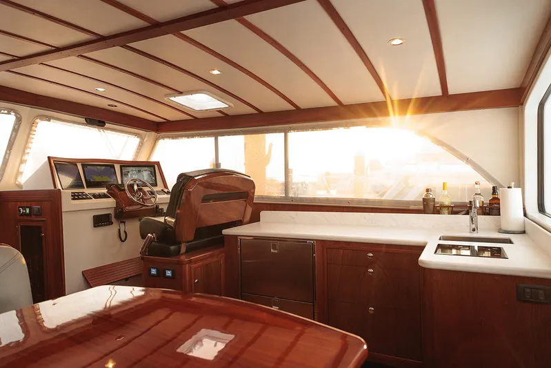  Yacht Photos Pics Luxurious interior of 2022 Composite Yacht CY46 with sunset view through windows.