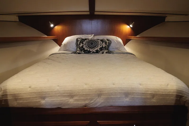  Yacht Photos Pics Luxurious bedroom interior of 2022 Composite Yacht CY46 with elegant bedding and ambient lighting.