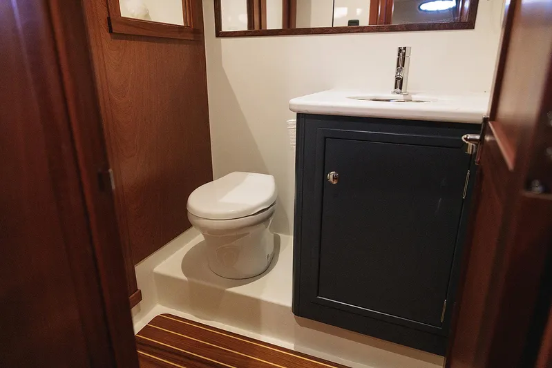  Yacht Photos Pics Luxurious bathroom in 2022 Composite Yacht CY46 with modern fixtures and wood accents.