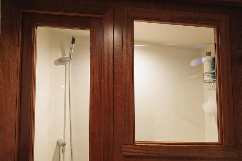  Yacht Photos Pics Shower area in 2022 Composite Yacht CY46 with wooden frame and glass panels.