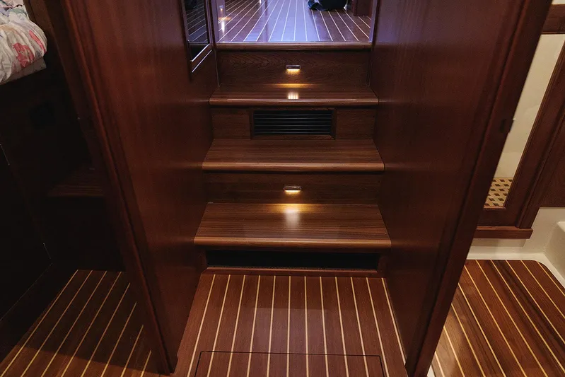  Yacht Photos Pics Luxurious wooden staircase inside 2022 Composite Yacht CY46, featuring elegant lighting and polished finish.
