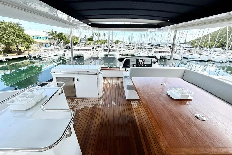  Yacht Photos Pics Luxurious 2026 Aventura 56 Motor Yacht with spacious deck and marina view.