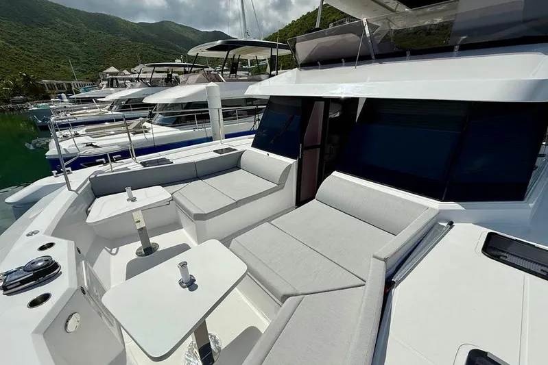  Yacht Photos Pics Luxurious 2026 Aventura 56 Motor Yacht with spacious outdoor seating and sleek design.