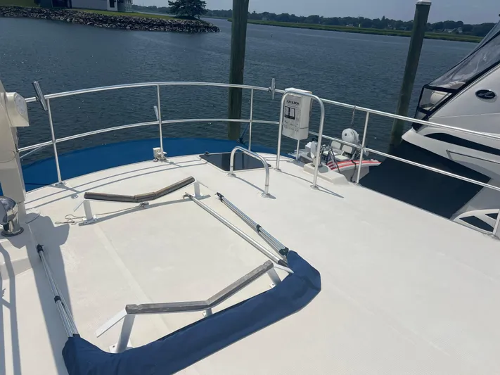  Yacht Photos Pics Deck of 1998 Cherubini Independence yacht docked by a serene waterfront.