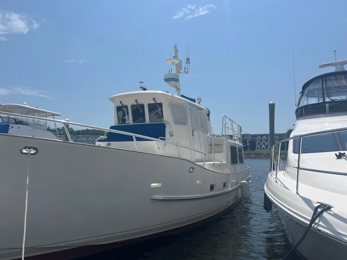  Yacht Photos Pics Cherubini Independence 1998 yacht docked under clear blue sky.