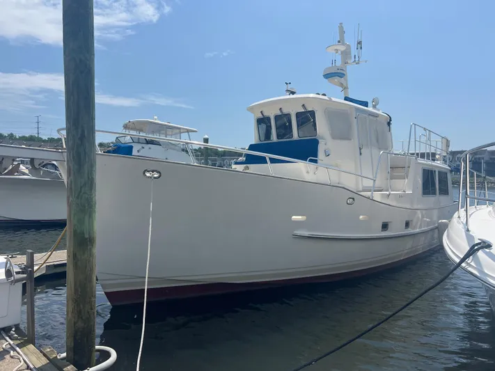  Yacht Photos Pics Cherubini Independence 1998 yacht docked at marina under clear blue sky.