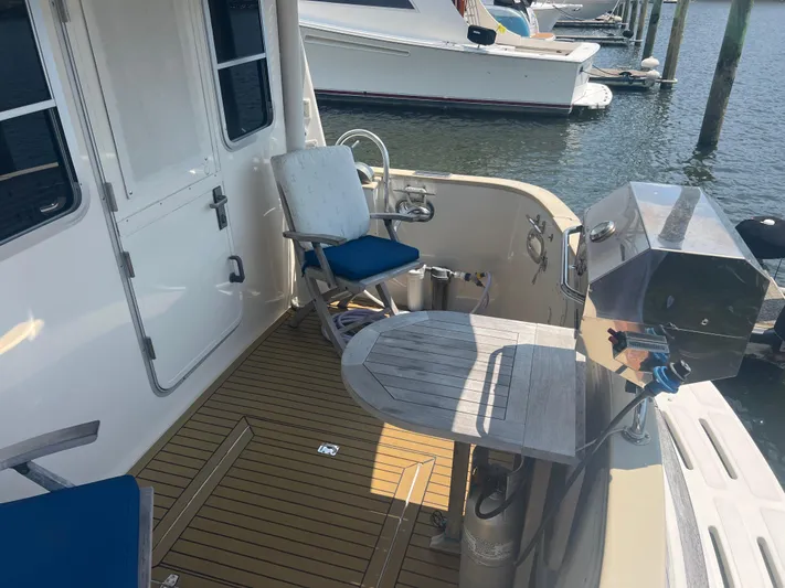  Yacht Photos Pics 1998 Cherubini Independence yacht deck with seating and grill at marina.