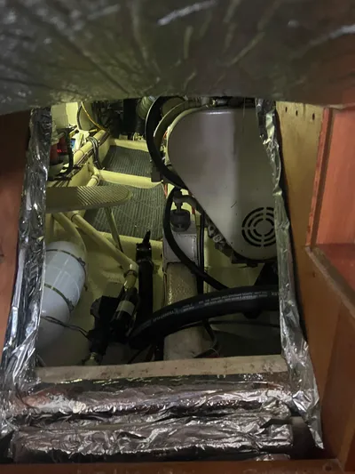  Yacht Photos Pics Engine room of a 1998 Cherubini Independence boat, showing mechanical components and insulation.
