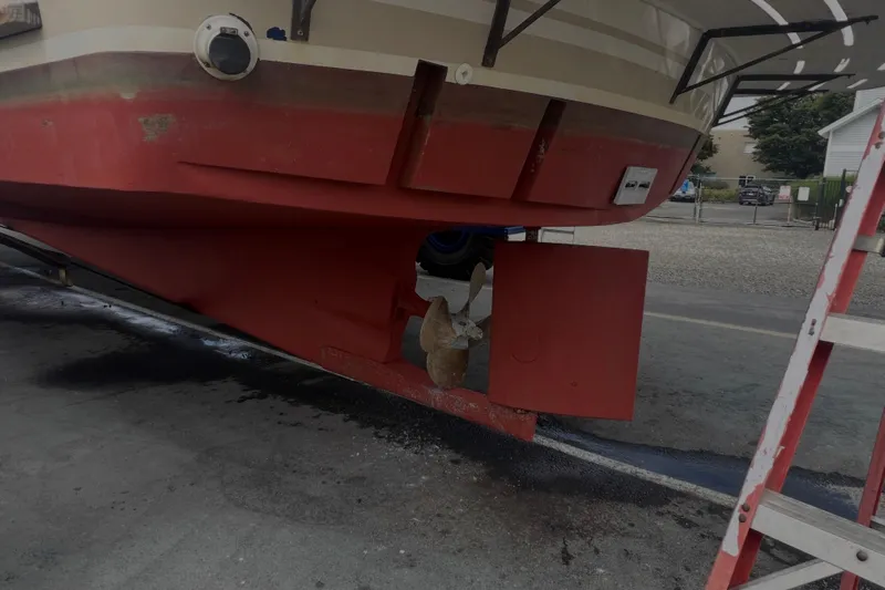  Yacht Photos Pics 1998 Cherubini Independence boat hull with visible propeller and rudder in a dry dock.