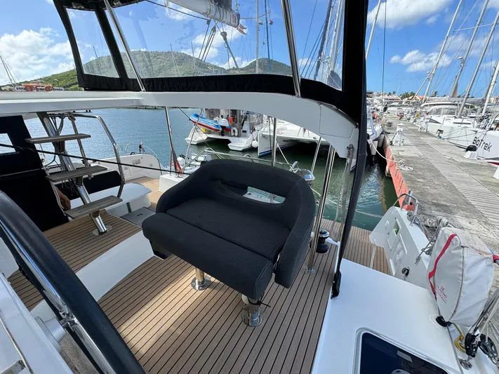 Bluevana Yacht Photos Pics 2023 Lagoon 42 catamaran with sleek deck design, docked in a marina under clear skies.