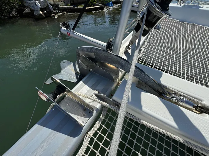 Bluevana Yacht Photos Pics Anchor setup on 2023 Lagoon 42 catamaran, docked by the water.