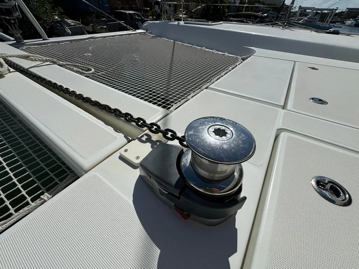 Bluevana Yacht Photos Pics Deck of 2023 Lagoon 42 catamaran with anchor chain and winch.