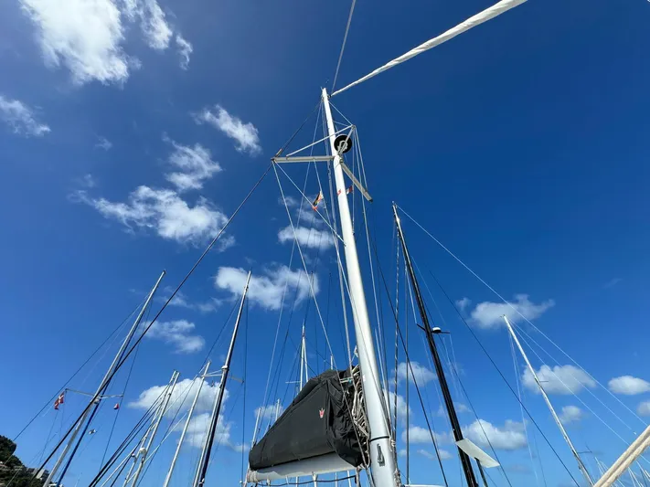 Bluevana Yacht Photos Pics Sailboat masts against a clear blue sky, Lagoon 42, 2023 model.