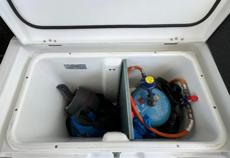 Bluevana Yacht Photos Pics Storage compartment in 2023 Lagoon 42 yacht with gas cylinder and equipment.