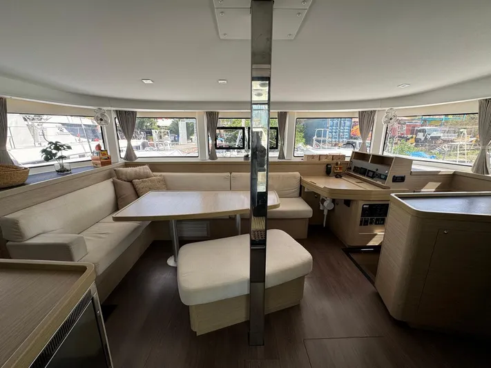 Bluevana Yacht Photos Pics Interior of 2023 Lagoon 42 catamaran with modern seating and navigation area.