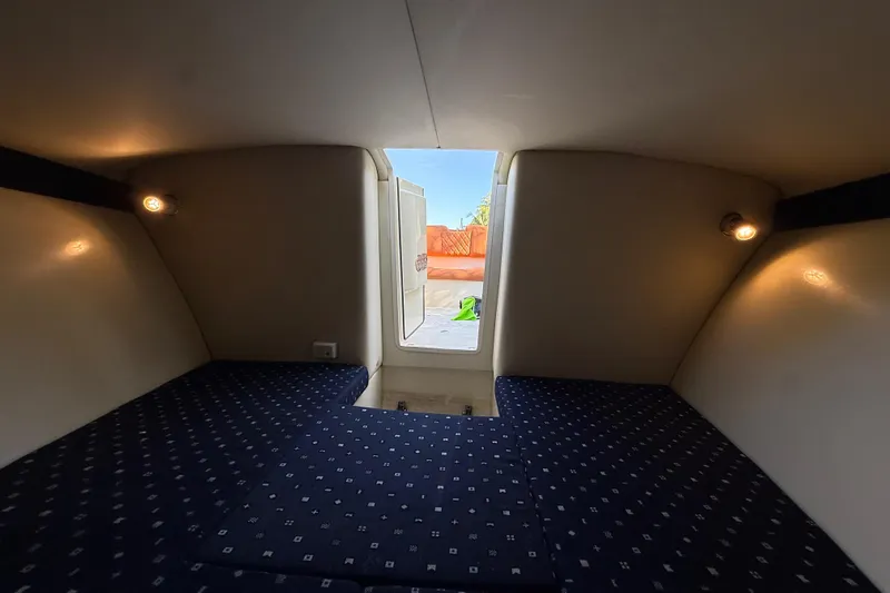  Yacht Photos Pics Interior cabin of 2018 Chris-Craft Capri 27 with cozy seating and ambient lighting.