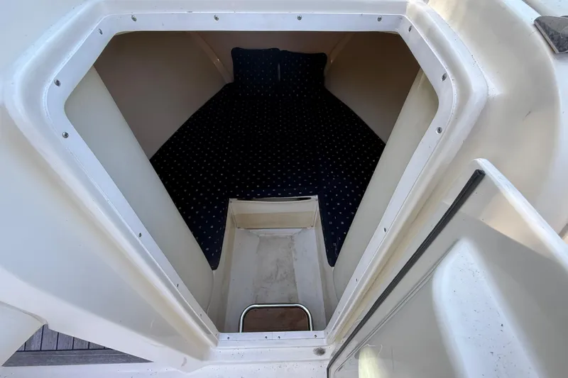  Yacht Photos Pics 2018 Chris-Craft Capri 27 cabin interior with cozy sleeping area.