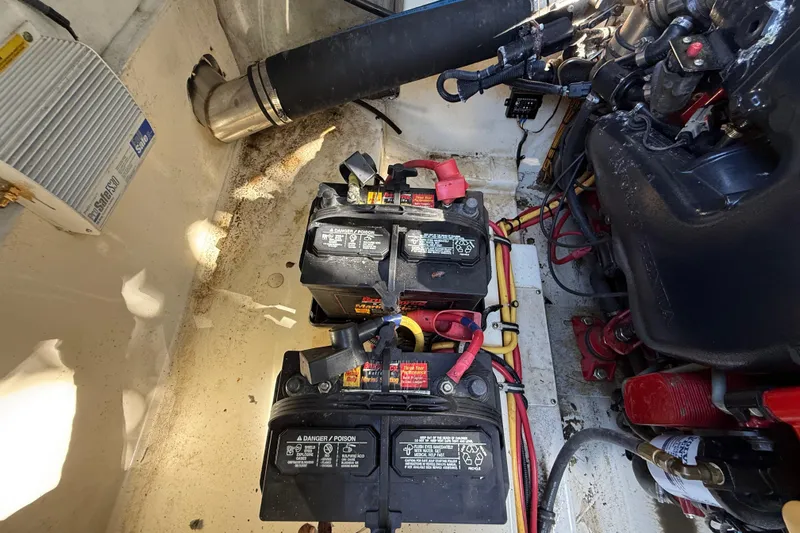  Yacht Photos Pics Engine compartment of 2018 Chris-Craft Capri 27 with dual batteries and wiring.